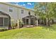 Spacious backyard featuring a well-maintained lawn and screened-in patios perfect for outdoor relaxation and entertaining at 1852 Garden Sage Dr, Oviedo, FL 32765