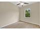 Bright bedroom with wood-look floors and a large window showcasing nature views at 1852 Garden Sage Dr, Oviedo, FL 32765