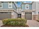 Charming townhouse featuring a gray facade, stone accents, and a well-manicured landscape at 1852 Garden Sage Dr, Oviedo, FL 32765