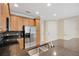 Kitchen displaying a stainless steel sink, wood cabinets, granite countertops, and recessed lighting at 1852 Garden Sage Dr, Oviedo, FL 32765