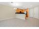 Open floor plan features a kitchen with wood cabinets, stainless appliances, and spacious living area at 1852 Garden Sage Dr, Oviedo, FL 32765