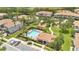 Aerial view of community pool and playground area with lush landscaping, creating a relaxing and Gathering-friendly atmosphere at 1852 Garden Sage Dr, Oviedo, FL 32765