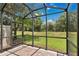 Enjoy the outdoors with this screened patio that offers a view of the green lawn and the surrounding natural landscape at 1852 Garden Sage Dr, Oviedo, FL 32765
