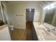 Bathroom featuring double sinks, tiled floors, and a glass-enclosed shower at 211 Valencia Rd, Debary, FL 32713