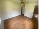 Bedroom featuring hardwood floors, a ceiling fan, and natural light at 211 Valencia Rd, Debary, FL 32713