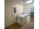 Bright laundry room features a full-size washer and dryer for convenient in-home laundry at 211 Valencia Rd, Debary, FL 32713