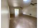 Open living area featuring tile flooring, ceiling fans, and natural light from the skylight at 211 Valencia Rd, Debary, FL 32713