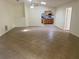 Open-concept living area with tiled floors, ceiling fan, and kitchen view at 211 Valencia Rd, Debary, FL 32713