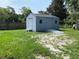 Backyard shed complete with double door entry, a ramp, and window at 211 Valencia Rd, Debary, FL 32713