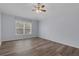 Bright bedroom with ceiling fan, offering a cozy retreat with new flooring at 2255 Tealwood Cir, Tavares, FL 32778