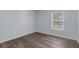 Cozy bedroom featuring new floors and a bright window with backyard view at 2255 Tealwood Cir, Tavares, FL 32778