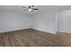 Spacious bedroom with ceiling fan and new flooring, ready for a relaxing retreat at 2255 Tealwood Cir, Tavares, FL 32778