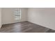 Comfortable bedroom featuring new floors and a bright window with a front yard view at 2255 Tealwood Cir, Tavares, FL 32778