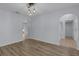 Neutral dining area with modern chandelier, and arched access to living spaces at 2255 Tealwood Cir, Tavares, FL 32778