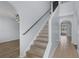 Bright staircase with wood flooring and access to the upper level at 2255 Tealwood Cir, Tavares, FL 32778