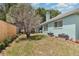 Property featuring fenced backyard with mature trees offering additional privacy at 2283 Knollwood Dr, Leesburg, FL 34748