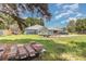 Spacious backyard offering lots of space for outdoor activities and gardening at 2283 Knollwood Dr, Leesburg, FL 34748
