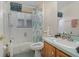 Cozy bathroom featuring a shower-tub combo and ample natural light at 2283 Knollwood Dr, Leesburg, FL 34748