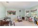 Cozy bonus room with a piano and chair, perfect for relaxation or entertainment at 2283 Knollwood Dr, Leesburg, FL 34748