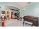 Open concept bonus room, adjacent to the living room, providing ample space for leisure activities at 2283 Knollwood Dr, Leesburg, FL 34748
