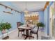 Cozy dining room with a charming chandelier and decor, providing a warm and inviting atmosphere at 2283 Knollwood Dr, Leesburg, FL 34748