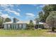 Charming single-story home with lush front yard and well-maintained landscaping at 2283 Knollwood Dr, Leesburg, FL 34748