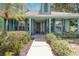 Inviting front entrance with decorative landscaping and covered porch area at 2283 Knollwood Dr, Leesburg, FL 34748