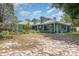 Attractive home with inviting front porch and well-maintained landscaping at 2283 Knollwood Dr, Leesburg, FL 34748