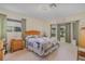 Bedroom features a large bed, bay window, and ample natural light at 2283 Knollwood Dr, Leesburg, FL 34748