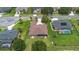 Aerial view of home featuring lush lawn and landscaping, with a spacious backyard and screened in patio at 23538 Valderama Ln, Sorrento, FL 32776