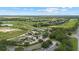 Aerial view of Eagle Dunes Golf Club, parking lot and surrounding neighborhood at 23538 Valderama Ln, Sorrento, FL 32776
