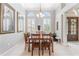 Formal dining room with wooden table, chairs, and elegant decor at 23538 Valderama Ln, Sorrento, FL 32776