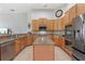 Spacious kitchen with stainless steel appliances, granite countertops, and central island at 23538 Valderama Ln, Sorrento, FL 32776