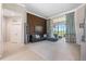 Open living space with a comfortable sectional sofa, natural light, and views of the golf course at 23538 Valderama Ln, Sorrento, FL 32776