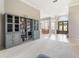 Open-concept living room with built-in shelves and view into dining area at 23538 Valderama Ln, Sorrento, FL 32776