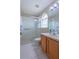 Clean bathroom with a stand-up shower, sink, and modern fixtures at 2406 Blossomwood Dr, Oviedo, FL 32765