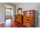 This bedroom features hardwood floors and furniture with a large bay window at 2406 Blossomwood Dr, Oviedo, FL 32765