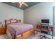 This bedroom is equipped with a desk and chair, has light green walls and marble floors at 2406 Blossomwood Dr, Oviedo, FL 32765