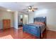 Charming bedroom with a ceiling fan, wood floors, and a closet at 2406 Blossomwood Dr, Oviedo, FL 32765