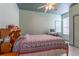 Cozy bedroom with colorful decor, ceiling fan, and matching ceiling and wall paint at 2406 Blossomwood Dr, Oviedo, FL 32765