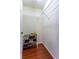 Walk-in closet featuring wood floors and wire shelving at 2406 Blossomwood Dr, Oviedo, FL 32765