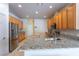 Open concept kitchen with granite countertops, stainless steel appliances and breakfast nook seating at 2406 Blossomwood Dr, Oviedo, FL 32765