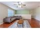 Comfortable living room featuring a ceiling fan, wood floors, and a neutral color palette, and stylish furnishings at 2406 Blossomwood Dr, Oviedo, FL 32765