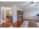 Spacious living room featuring a bookshelf and wood floors at 2406 Blossomwood Dr, Oviedo, FL 32765