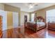 Spacious main bedroom with hardwood floors, ceiling fan, and a closet or dressing room visible at 2406 Blossomwood Dr, Oviedo, FL 32765
