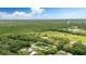 Aerial view of the property highlighting its location amidst lush greenery and nearby amenities at 255 Belinda Dr, Deland, FL 32720