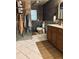Farmhouse bathroom features custom wood design with updated cabinets and countertop at 255 Belinda Dr, Deland, FL 32720