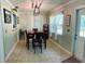 Bright dining room featuring a modern light fixture and a table set for a meal at 255 Belinda Dr, Deland, FL 32720
