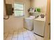 Functional laundry room equipped with a washer, dryer, and plenty of space for laundry tasks at 255 Belinda Dr, Deland, FL 32720