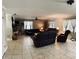 Expansive living room with tile floors, a ceiling fan, lots of seating, and natural light at 255 Belinda Dr, Deland, FL 32720